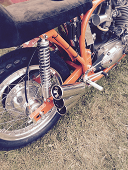 This bike uses the NJB Ultimate Shocks the traditional way up to give clearance for the unusual exhaust